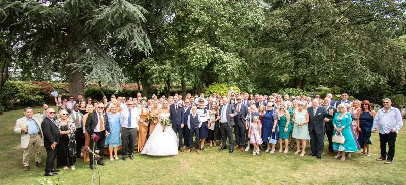The whole wedding party gathered outside