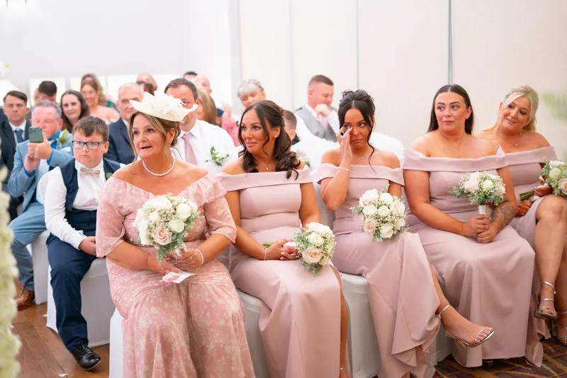 Bridesmaids head down the aisle