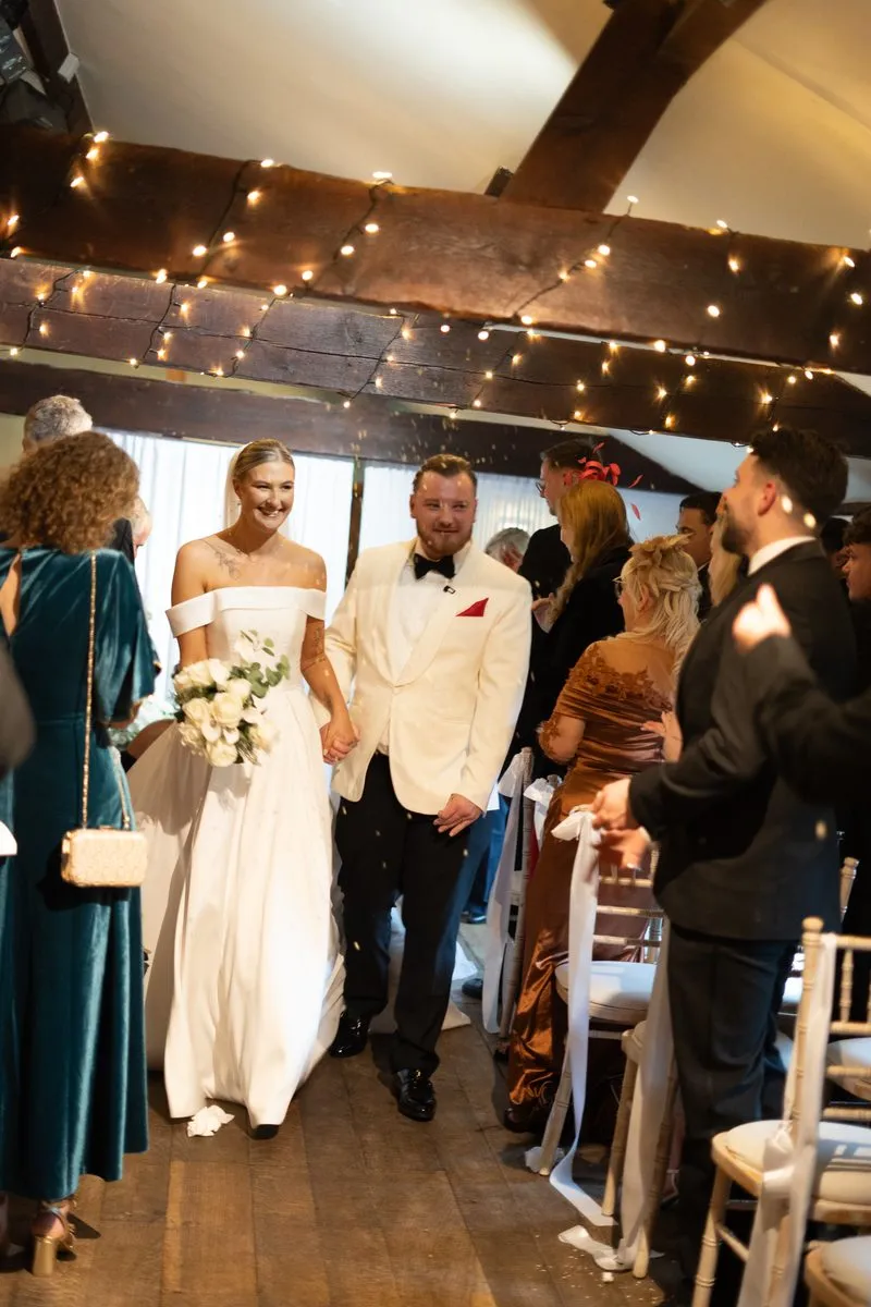 The couple under the festoon lights
