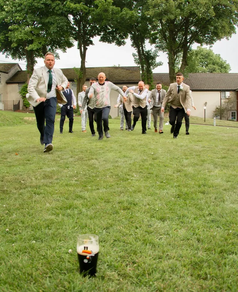 Guests race across the lawn for the last pint