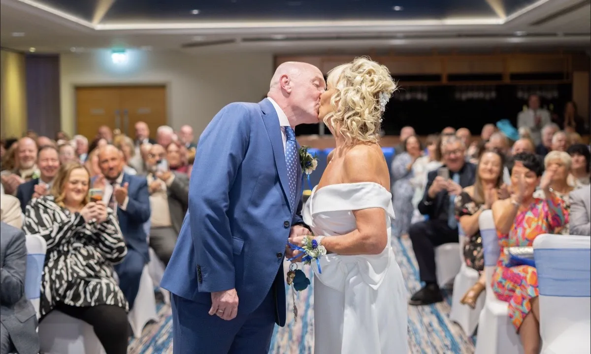 Tracey and David share their first kiss at their OEC Sheffield wedding ceremony