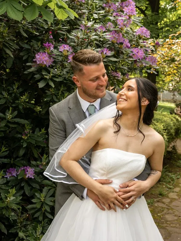 Candid wedding moment captured between the couple